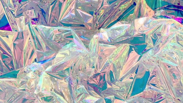 Shimmering holographic foil close up with crystal facets and pastel rainbow hues