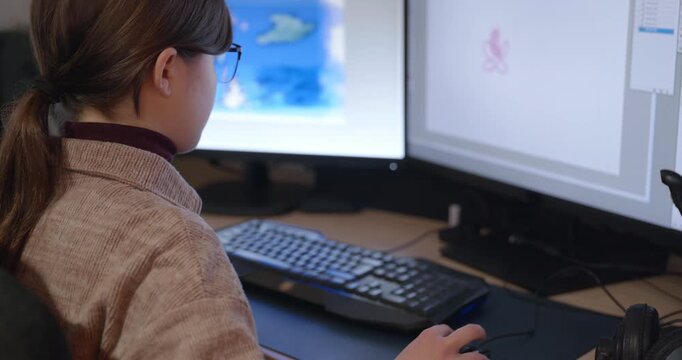 Girl with Glasses Drawing Picture on Desktop Computer Monitor. 4K 10-bit