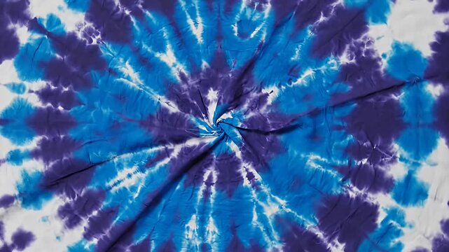 Vibrant blue and purple circular tie-dye textile pattern.