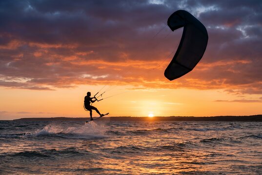 Sunset Kitesurfing: Thrilling Ocean Adventure at Golden Hour