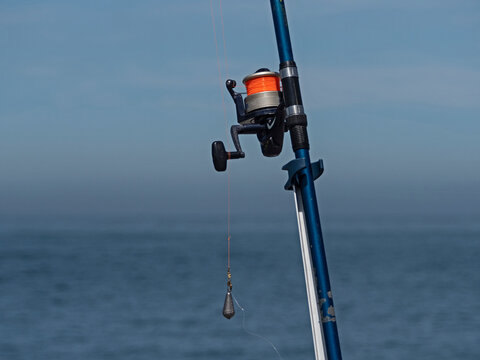Close-up shot of a large fishing rod with a sinker