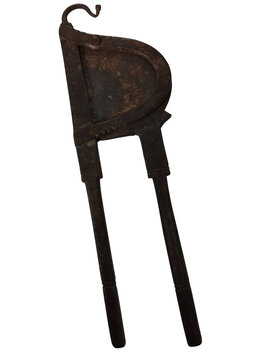Old rusty metal hand tool with curved blade and two handles