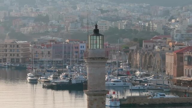  View of Chania with the amazing lighthouse, mosque, venetian shipyards, Crete, Greece.Waves crashing on lighthouse, Beautiful Greece and best scenic places - panorama