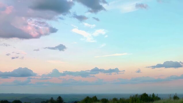 Elegant 4K motion graphic displaying a seamless liquid transition of delicate pastel hues blending into each other constructing a peaceful cloud like atmosphere perfect for spiritual meditation and