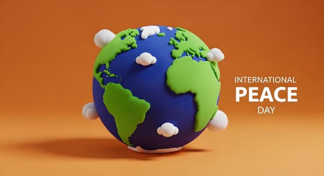 Clay model of the earth globe with small white clouds on an orange background for international peace day
