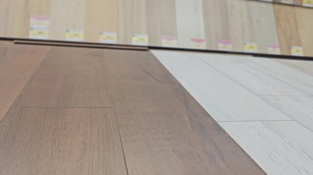 Samples of different flooring colors and textures in a store display