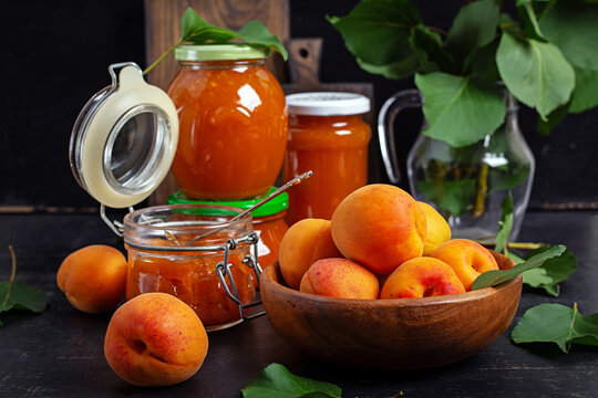 Homemade Apricot Jam in Glass Jars with Fresh Apricots