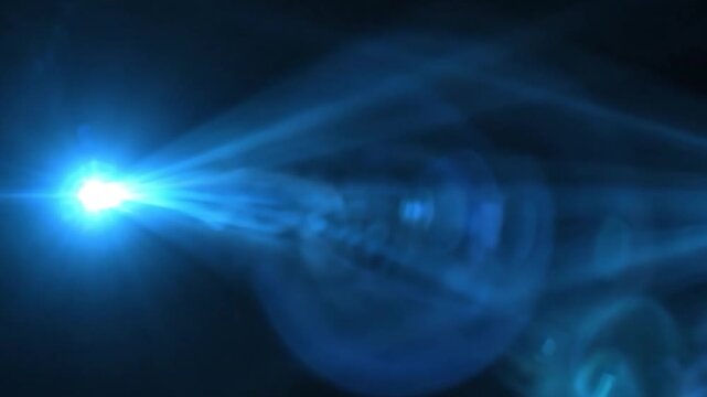 Bright blue lens flare light effect on black background