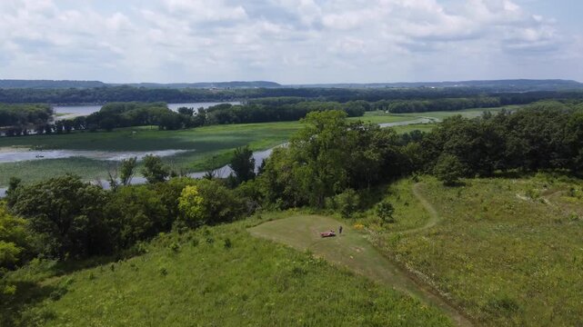 High approach Aerial of Casper Bluff just outside of Galena Illinois in summertime.  Hilly vista overlooking the Mississippi River. 