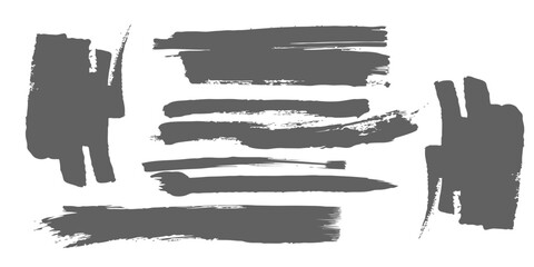 Obraz premium Set of dark grey paint brush strokes and grunge swatches for artistic banner design