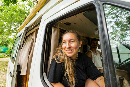 Female traveler in camper van on road trip in Ecuador