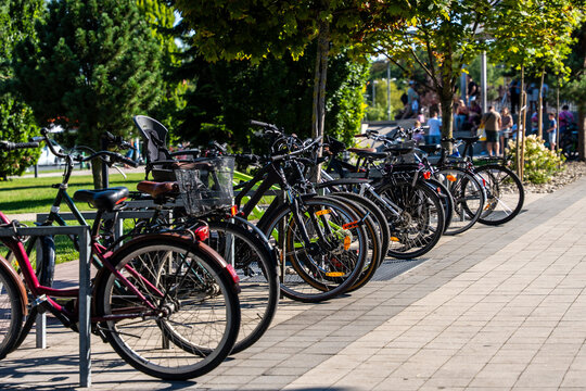 Bicycles Parked In Urban Bike Rack Sustainable Transport And Eco Friendly City Mobility