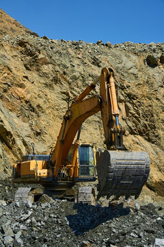 Excavator in an open-pit copper mining operation