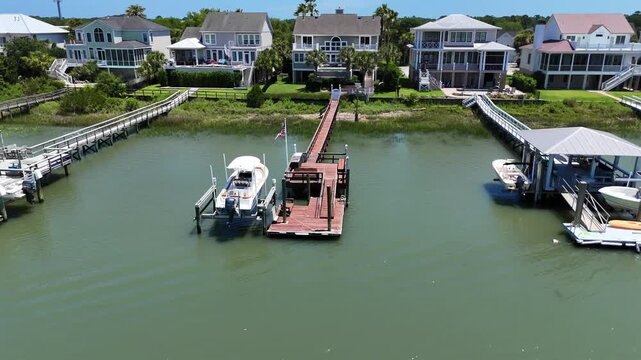 Right to left waterway Drone shot of Isle of Palms South Carolina in Summer, just outside of Charleston.  Beautiful sunny day on the water.