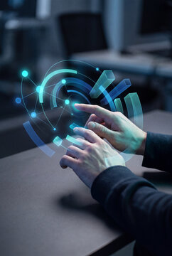 Close-up of hands interacting with a glowing geometric technology hologram