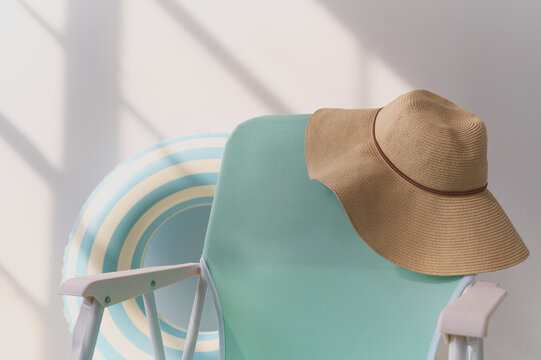 Poolside summer relaxation with a straw hat
