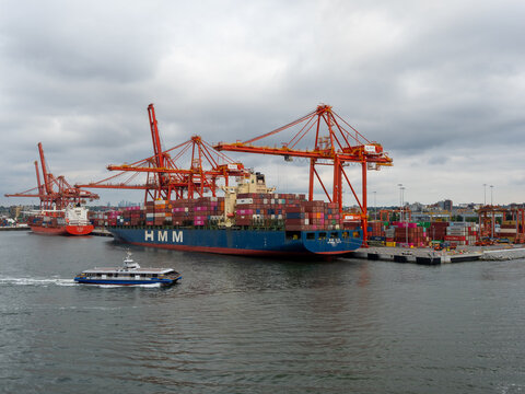 Vancouver BC, Canada - May 30, 2022: Container ships docked at Centerm container terminal in downtown Vancouver