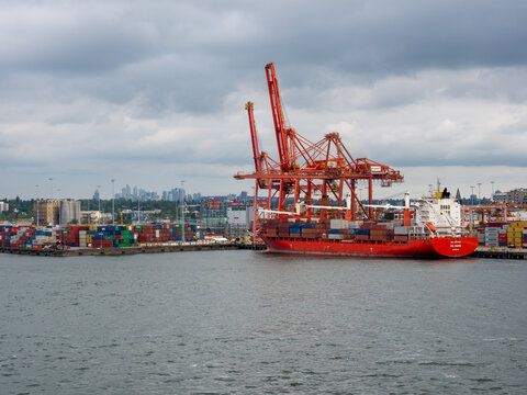 Vancouver BC, Canada - May 30, 2022: GSL Maren container ship docked at Centerm container terminal in downtown Vancouver