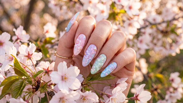 Nail Extension Art with White Polish Among Cherry Blossoms