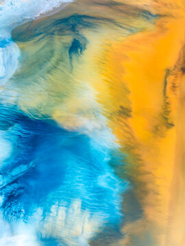 Vibrant abstract nature texture in blue and golden sand