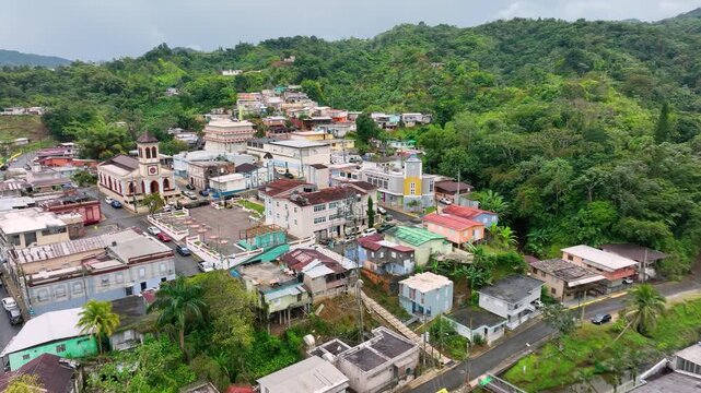 Drone footage passing over the colorful Jauya town square and past Parroquia Nuestra Se&ntilde;ora de la Monserrate, Puerto Rico