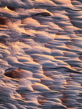 Volcanic pumice stone landscape texture in warm light
