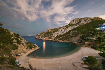 Obraz premium Dreamy Mediterranean Night at Granadella Beach Javea Spain Under Stars
