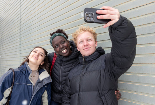 Friends taking selfie in snowy weather