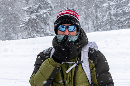 Skier portrait in heavy snowfall during Hokkaido tour
