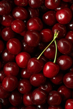 Close-up of ripe red cherries filling the frame