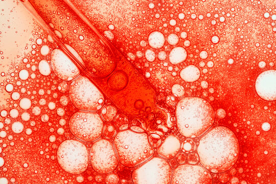 Pipette dropping serum into macro bubbles