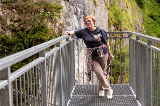 Woman enjoying a scenic view at a gorge lookout