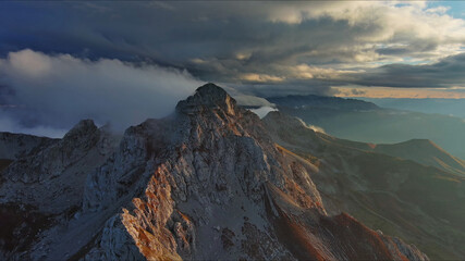 Obraz premium Aerial view of amazing rocky mountains at sunset