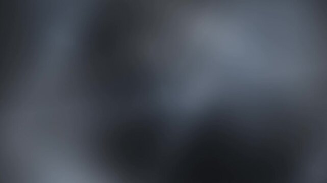 Seamless looping background with soft abstract blue and gray gradient effects.