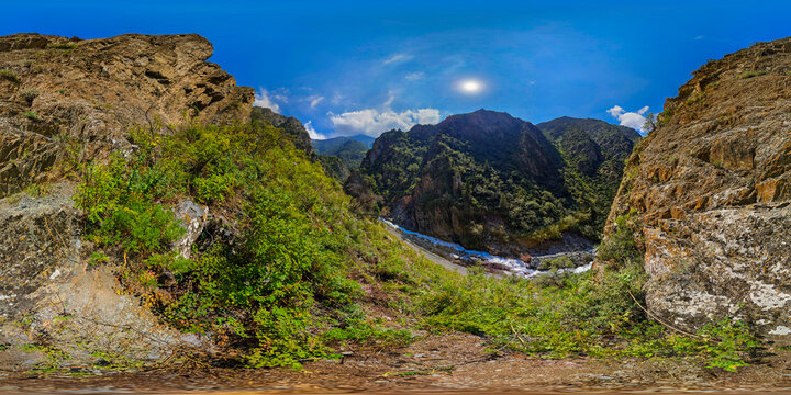 Rugged Mountain Gorge with Fast-Flowing River in Kyrgyzstan