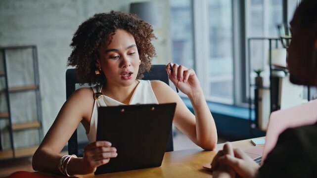 Businesswoman explaining documents job interview. Woman talking client meeting