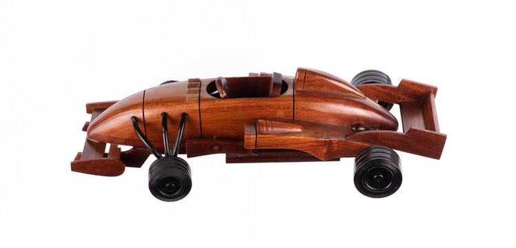 Wooden sports car toy isolated on white background