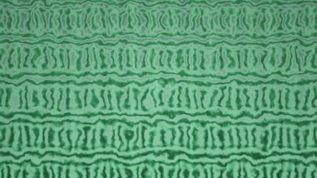 A seamless green background pattern featuring wavy, organic shapes arranged in horizontal rows.