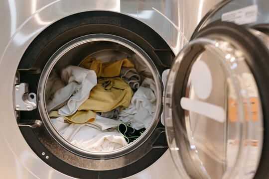 Laundromat washing machine with clothes inside