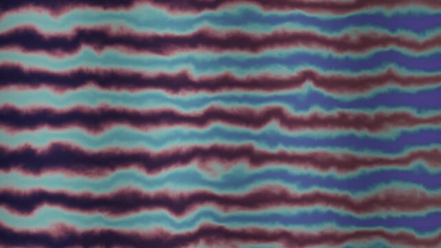 Seamless looping background of wavy purple and blue tie dye stripes on fabric