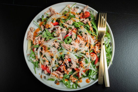 Fresh Tuna Salad with Onions and Cherry Tomatoes. Italian Mediterranean Cuisine
