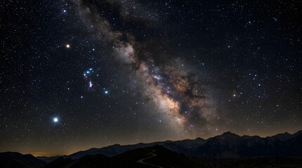 Fototapeta premium Milky way galaxy and Orion constellation over dark mountain silhouettes