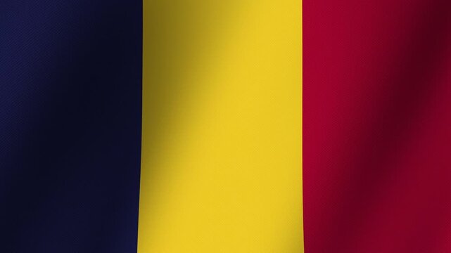 Flag of Chad: A close-up shot of the national flag of Chad, its tri-color stripes of blue, yellow, and red rippling gently in the breeze, symbolizing national pride and identity.