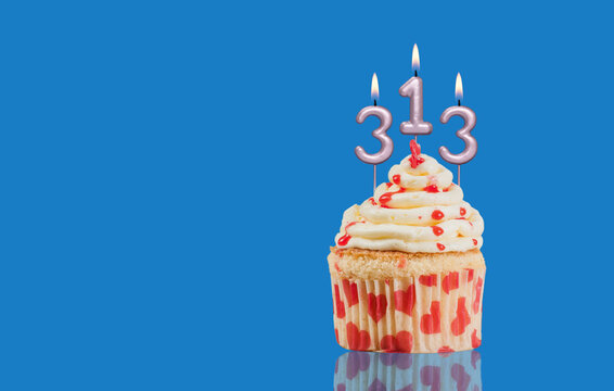 Birthday Or Anniversary Cupcake With Lit Candles; Candles Forming The Number 313