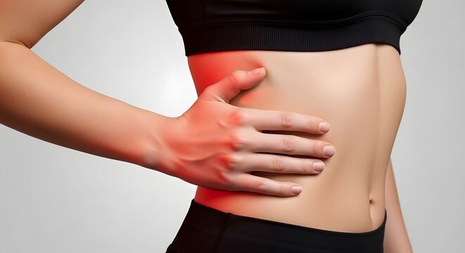Woman experiencing acute side pain, holding her painful rib cage with hand highlighted in red
