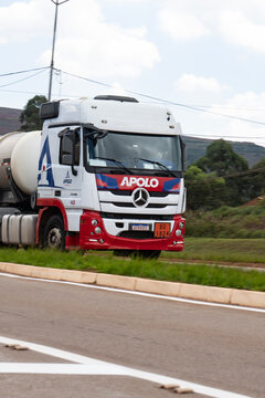 White Mercedes Benz Actros front three quarters moving, Heavy duty commercial truck driving on highway
