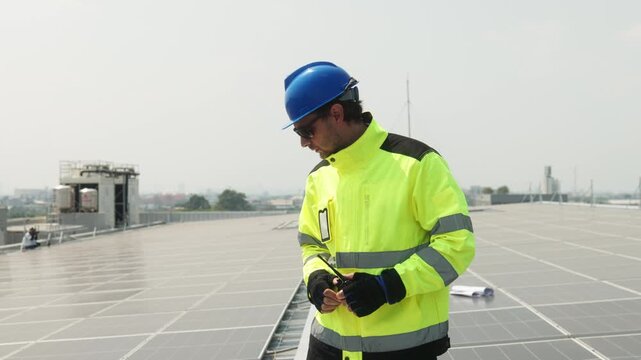 Close-up of solar technician measuring spacing between photovoltaic panels during rooftop installation and alignment of a solar energy system.
