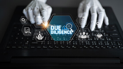 Robotic Hands Typing on Laptop with Cybernetic Icons Representing Due Diligence in Finance and...