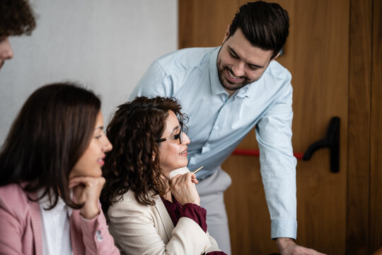 Business colleagues discussing project ideas during office meeting