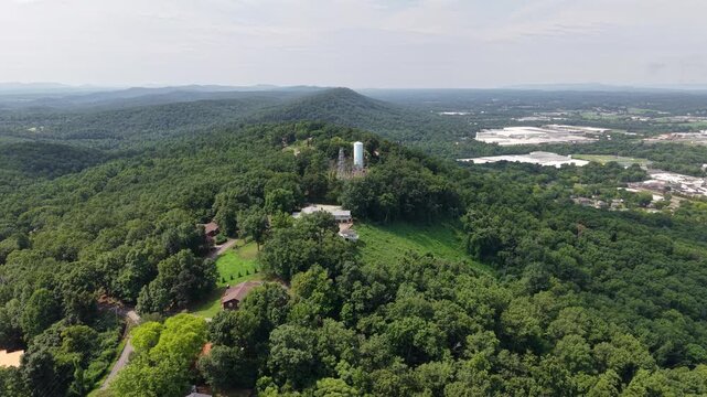 Aerial View of Fire Lookout Tower Atop Forested Hilltop Near Ringgold, Georgia